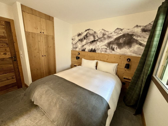 Appartement Alchimie 12C à Châtel, chambre avec lit double et armoire