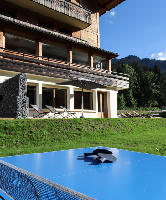 Apartment le Sommet in chalet la Cascade, Châtel, Terrace in summer ping-pong