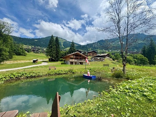 Chalet Haute Cime, private lake with table, Châtel Haute-Savoie, sunny mountain family vacations